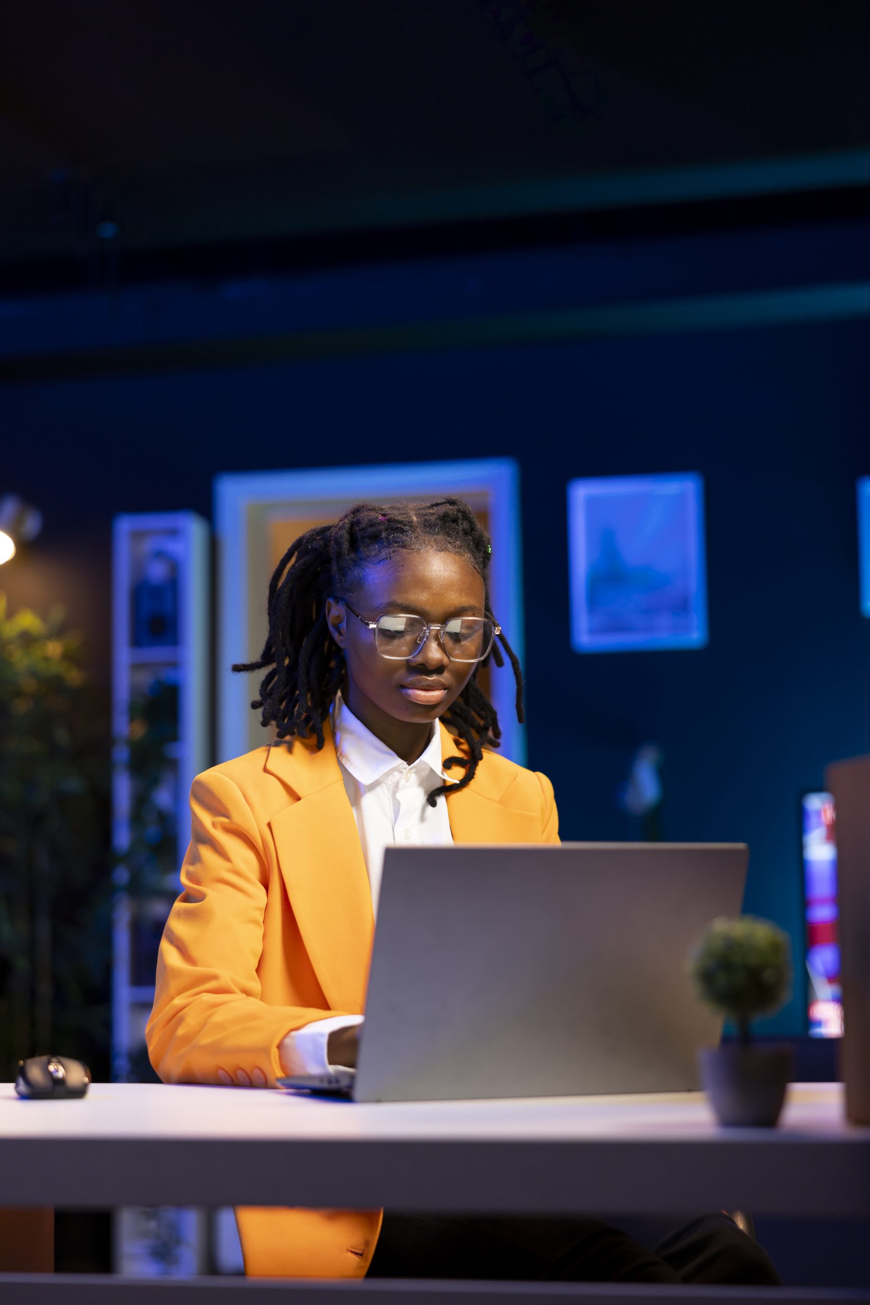 Teleworker in home office editing documents on notebook, updating reports and files, typing text. Freelancer managing digital paperwork within file directories on laptop, finishing tasks